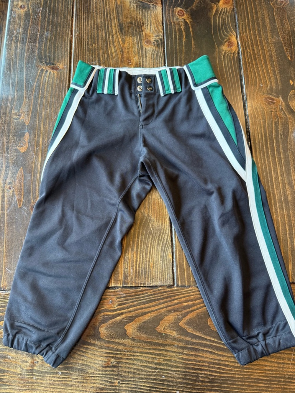 Boombah cropped softball pants.  Black with Green & White Side Stripes